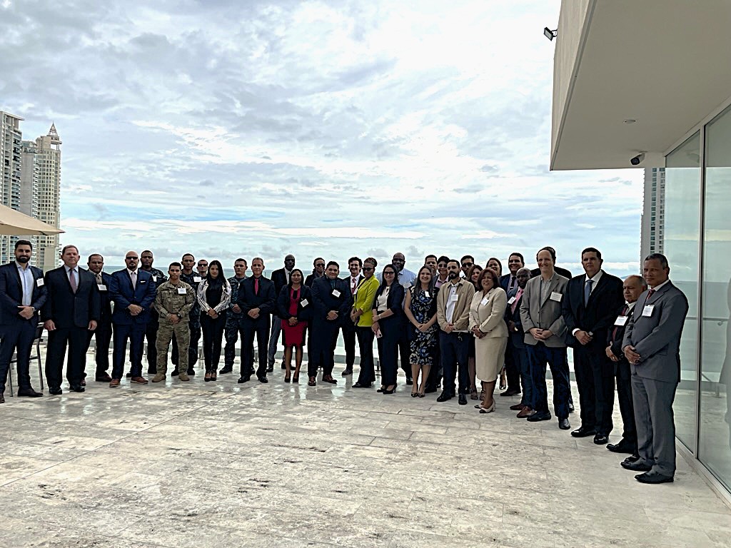 group in front of waterfront